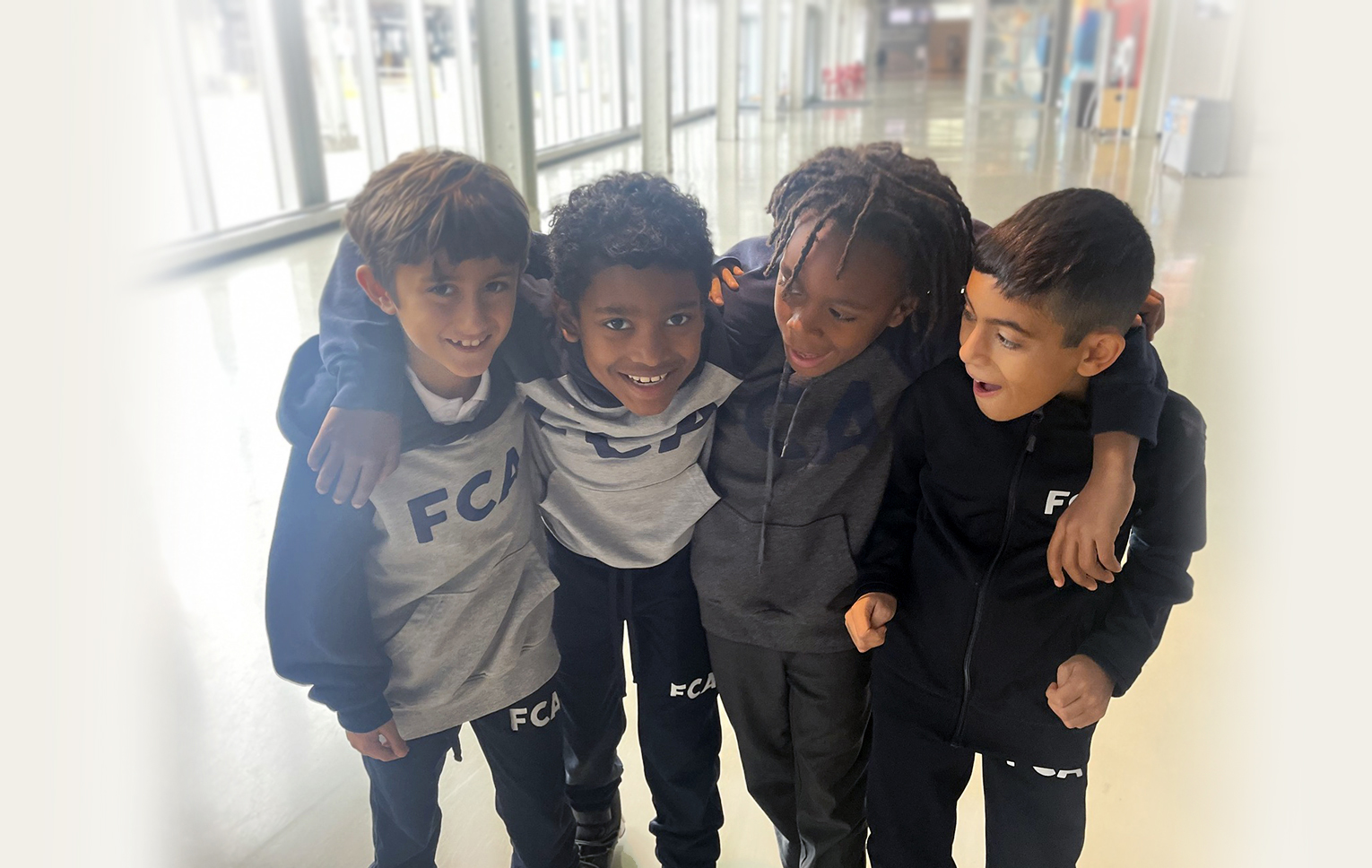 Four students sharing a moment of friendship
